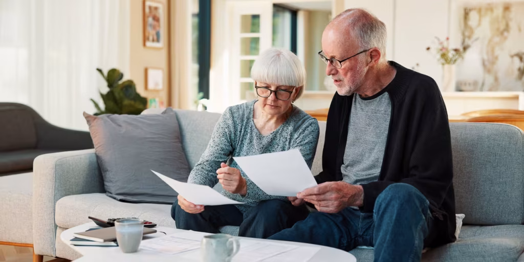 I'm 61. My wife and I have saved $1 million and will receive $14,000 monthly in pensions. We own three homes but won't pay them off for another 28 years. Is retirement possible for me next year?
