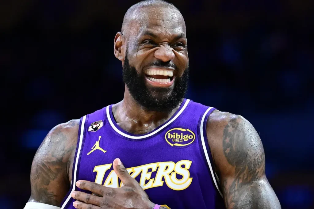 LeBron James of the Lakers sets an NBA record with a triple-double against the Mavericks.