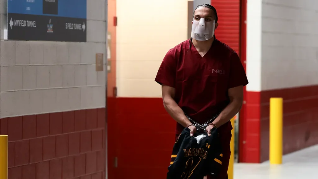 Mack Hollins makes an impression arriving barefoot with shackles and cuffs at the Super Bowl