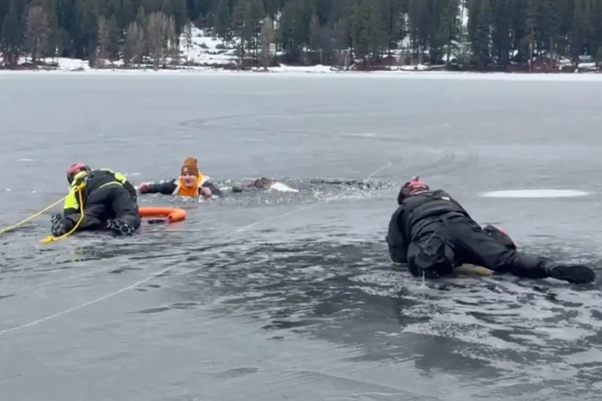 Man falls through ice into cold lake in front of police training for water rescues