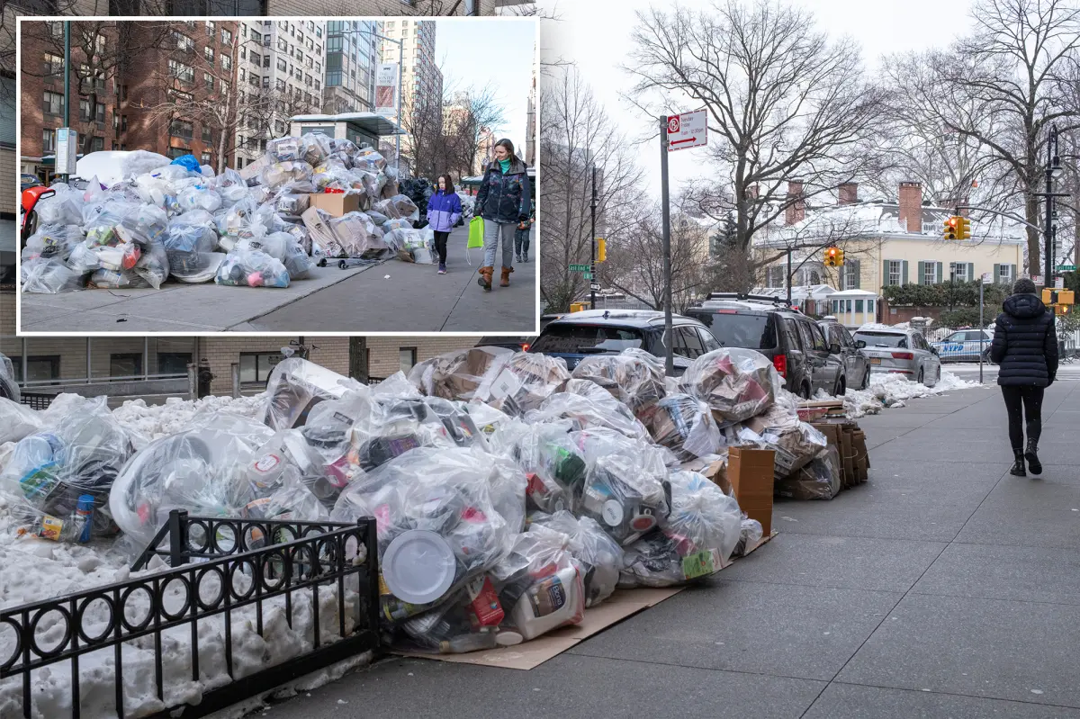 New York City garbage heaps grow as trash pickup is postponed following snowstorm