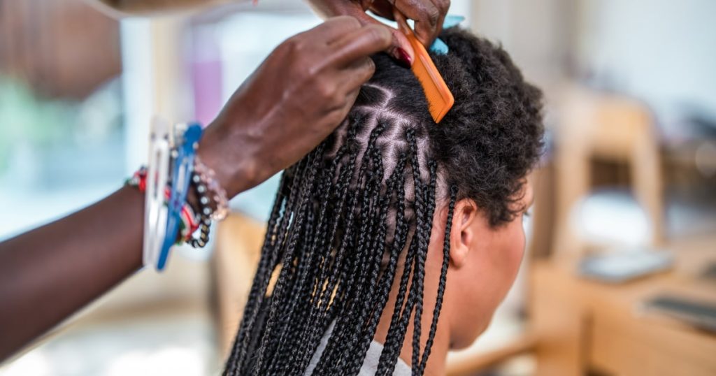 Study reveals dangerous chemicals hidden in hair extensions and braiding products for Black women.