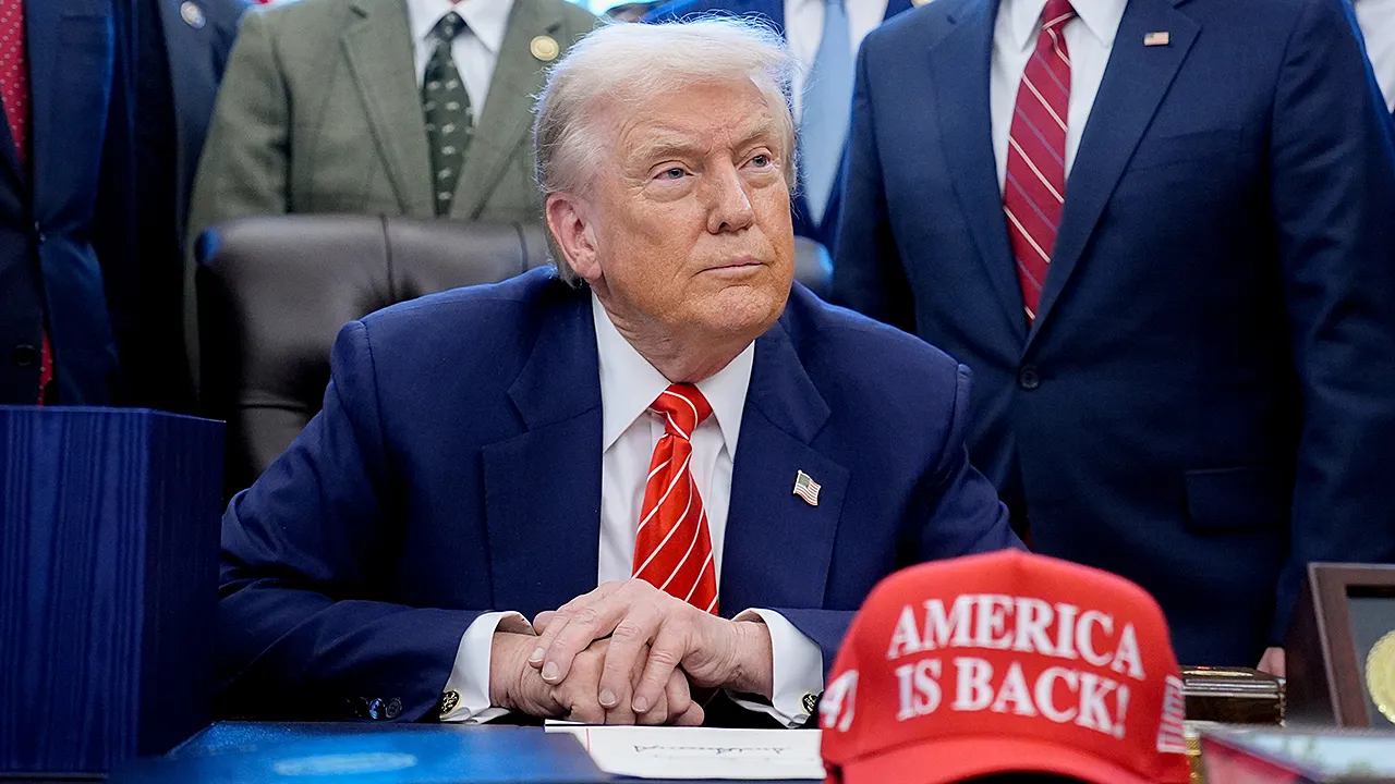 Trump unveils new 'America Is Back!' hat at White House bill signing event