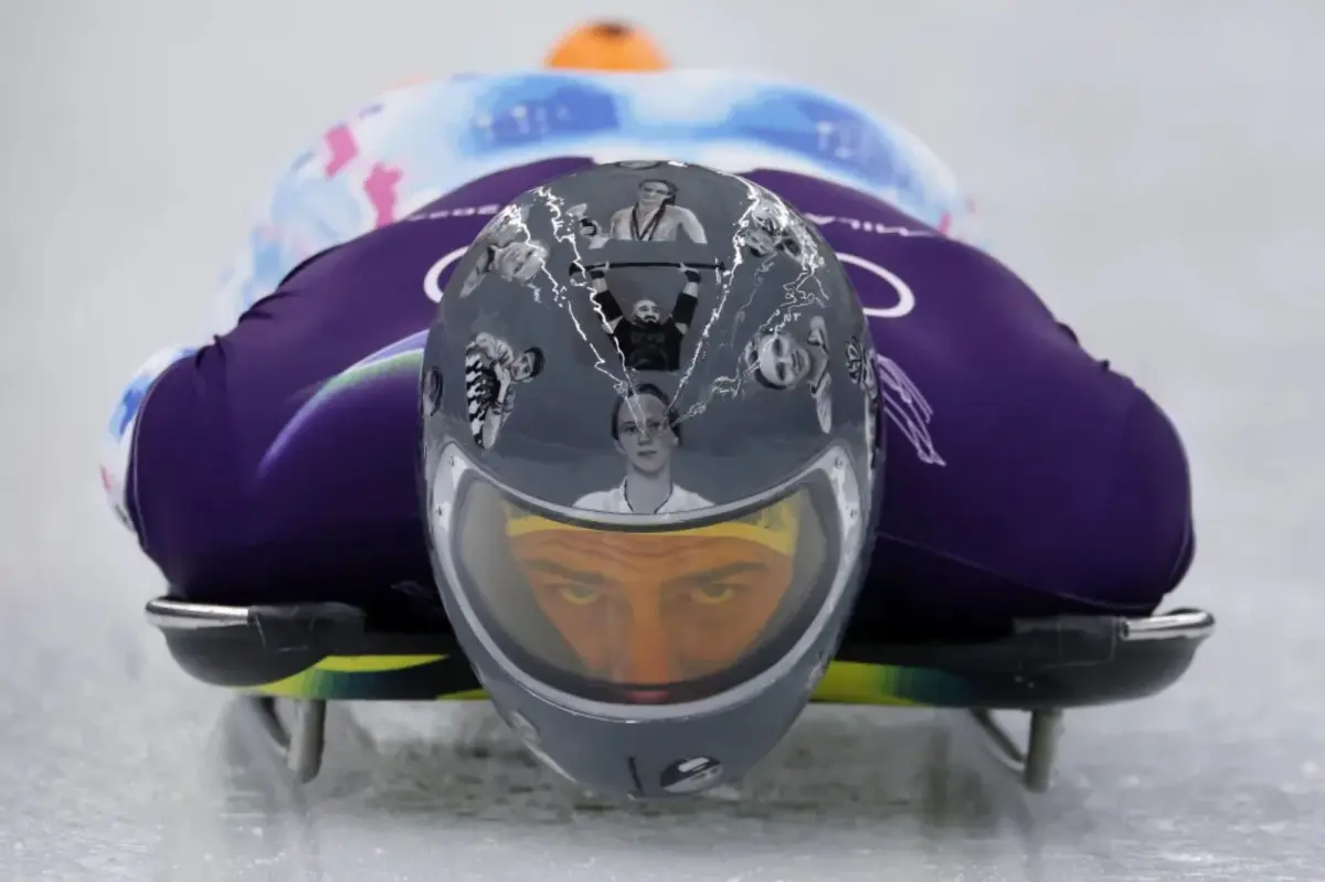 Ukraine's Vladyslav Heraskevych at the 2026 Winter Olympics wearing a helmet honoring athletes killed by Russia