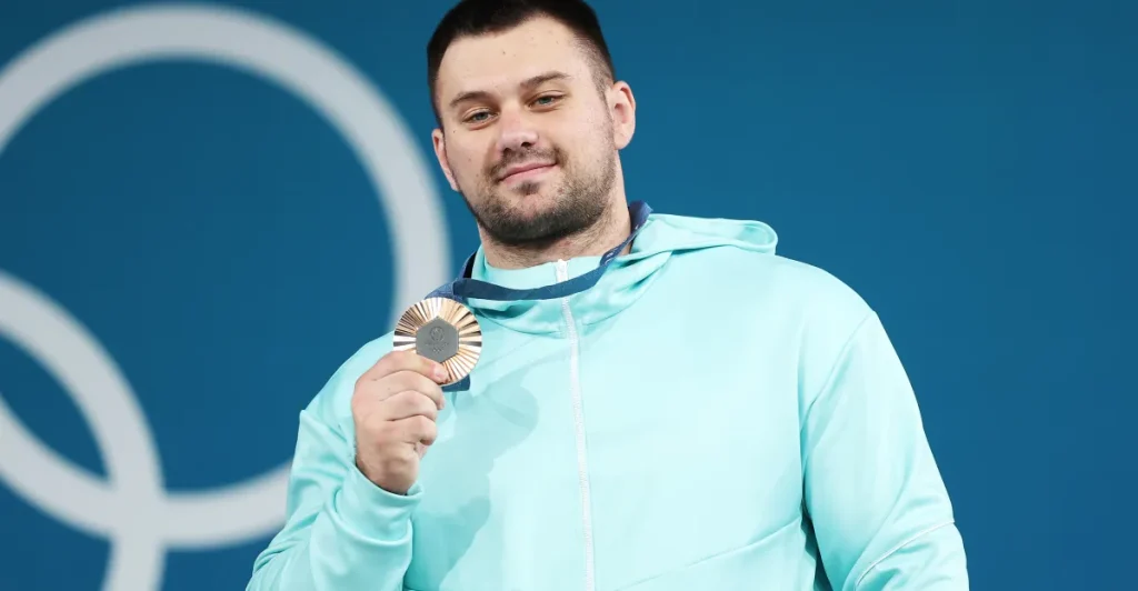 Why is Russia referred to as AIN at the 2026 Winter Olympics?