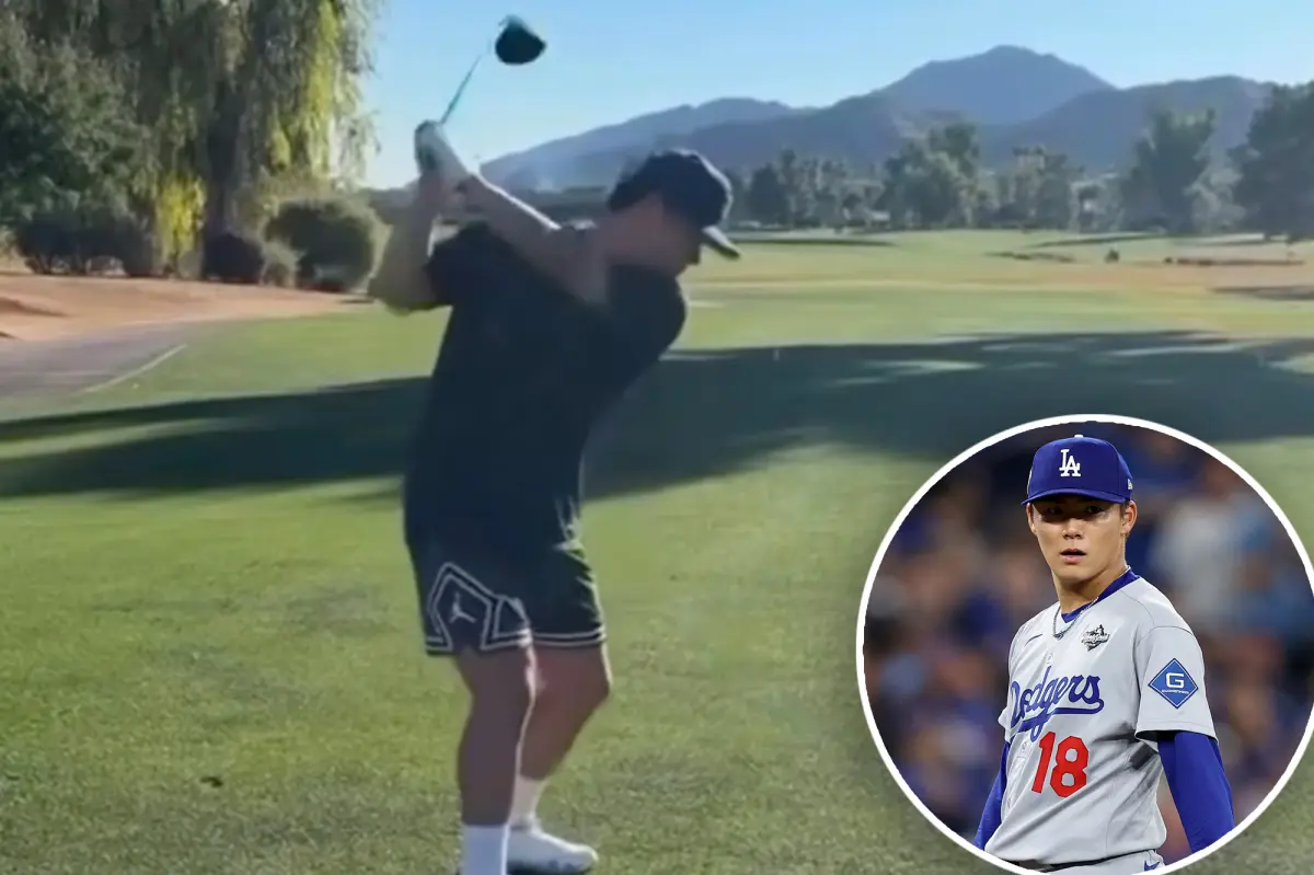 Yoshinobu Yamamoto of the Dodgers demonstrates his golf swing in Arizona