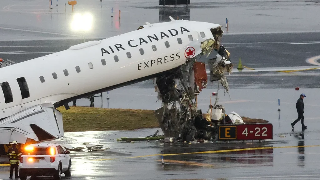 Footage reveals Air Canada plane colliding with fire truck at LaGuardia, resulting in the deaths of 2 pilots.