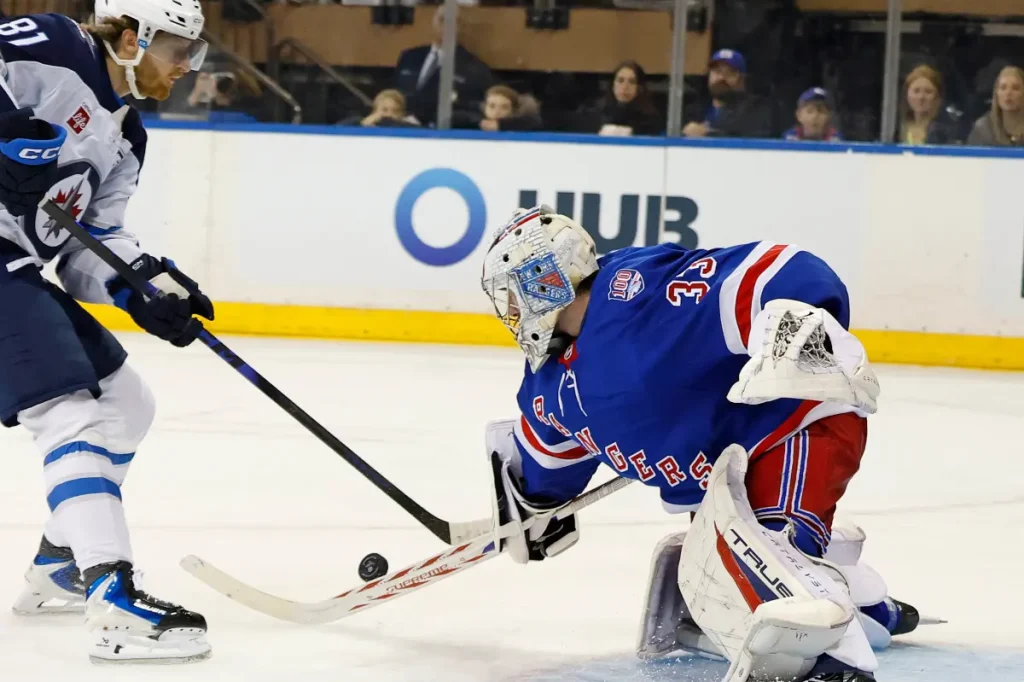 Goalie Dylan Garand shines in his NHL debut but the Rangers lose to the Jets