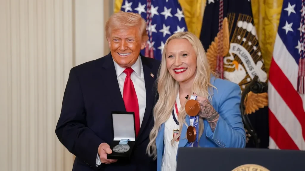 Kaillie Humphries presents the Order of Ikkos medal to Trump at the White House
