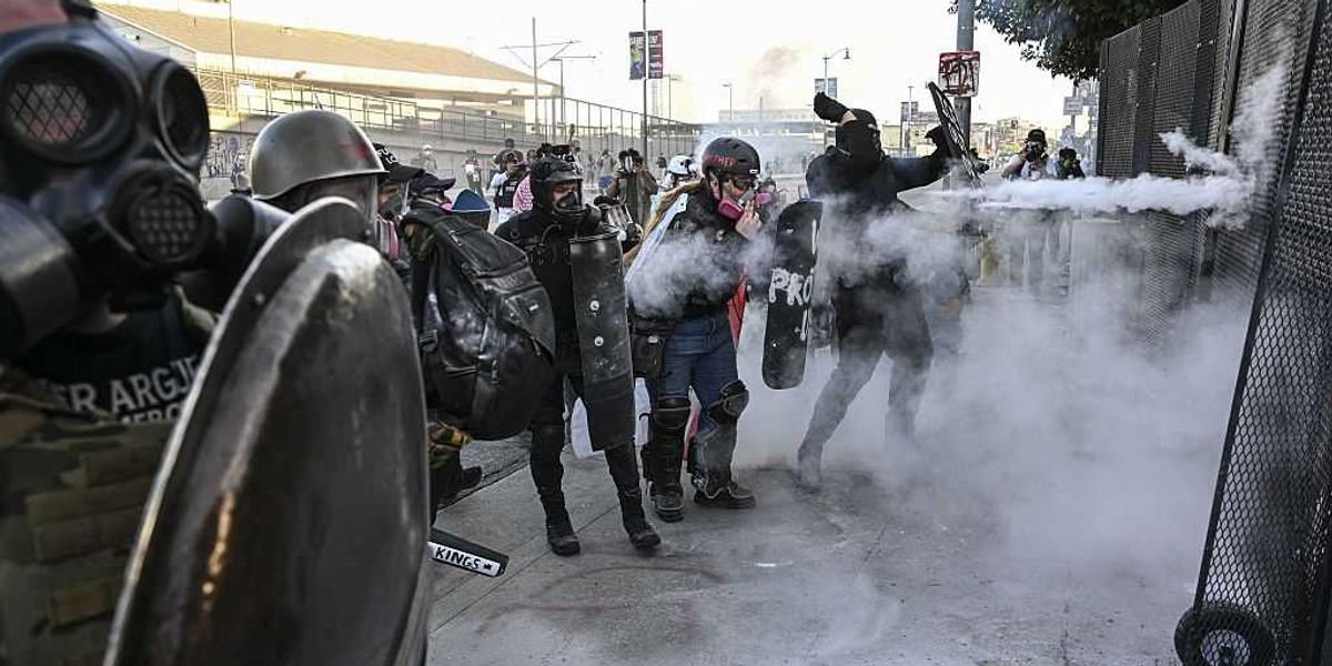 LA No Kings protest erupts into a violent clash as individuals hurl cement blocks at federal agents