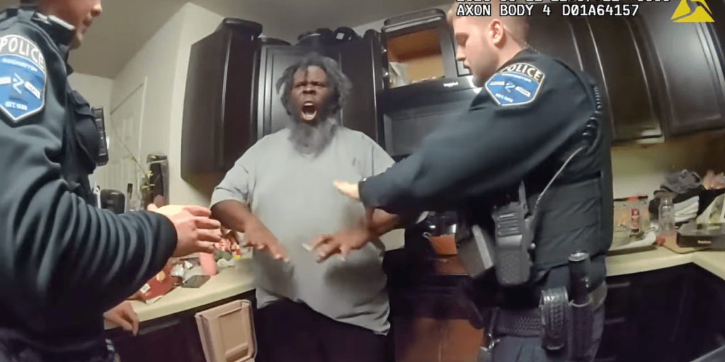 Man in mental health crisis seizes officer's gun and fires while being restrained; another officer responds with gunfire.