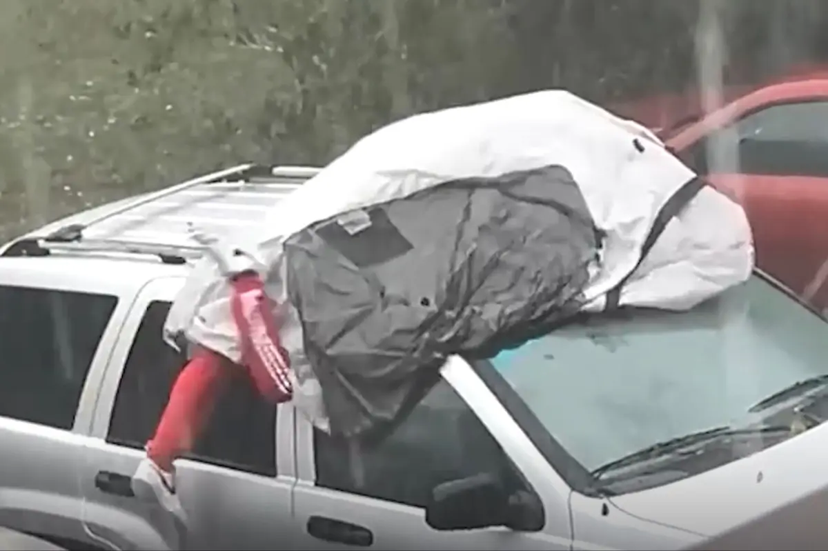 Man shields himself from hailstorm in dramatic video