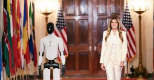 Melania Trump Walks with a Robot in Dolce & Gabbana