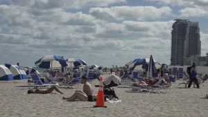 Miami Beach eases spring break regulations while authorities tighten enforcement.