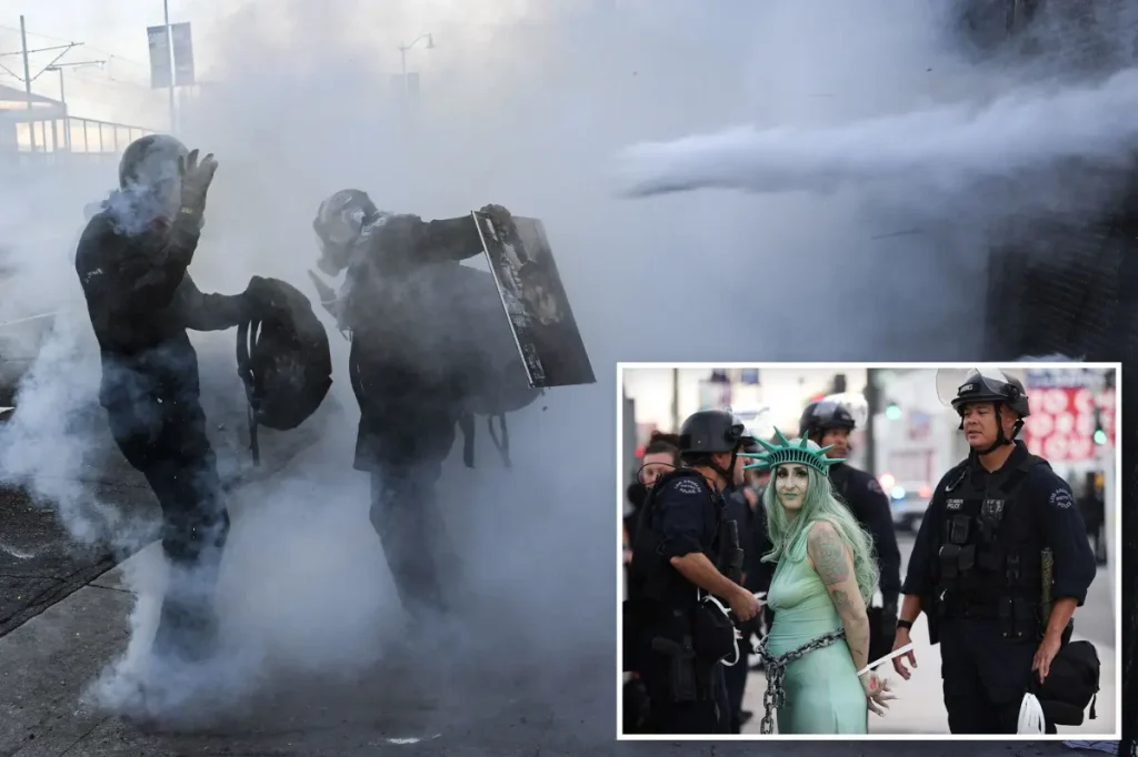 No Kings Rally becomes chaotic and woman in Statue of Liberty attire is taken into custody