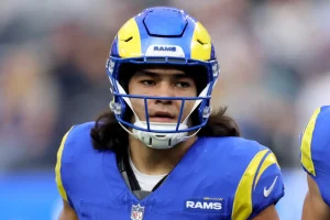 Puka Nacua is happily coaching football despite a bite lawsuit.