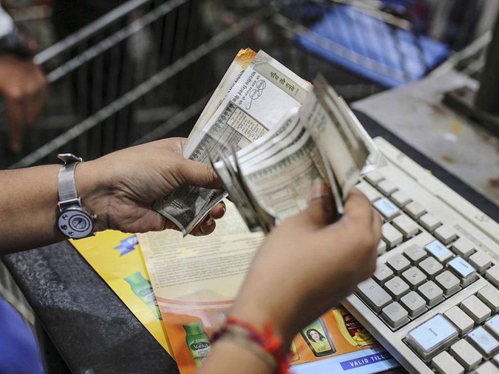 Rupee falls to a four-year low as rising oil prices increase remittance value.