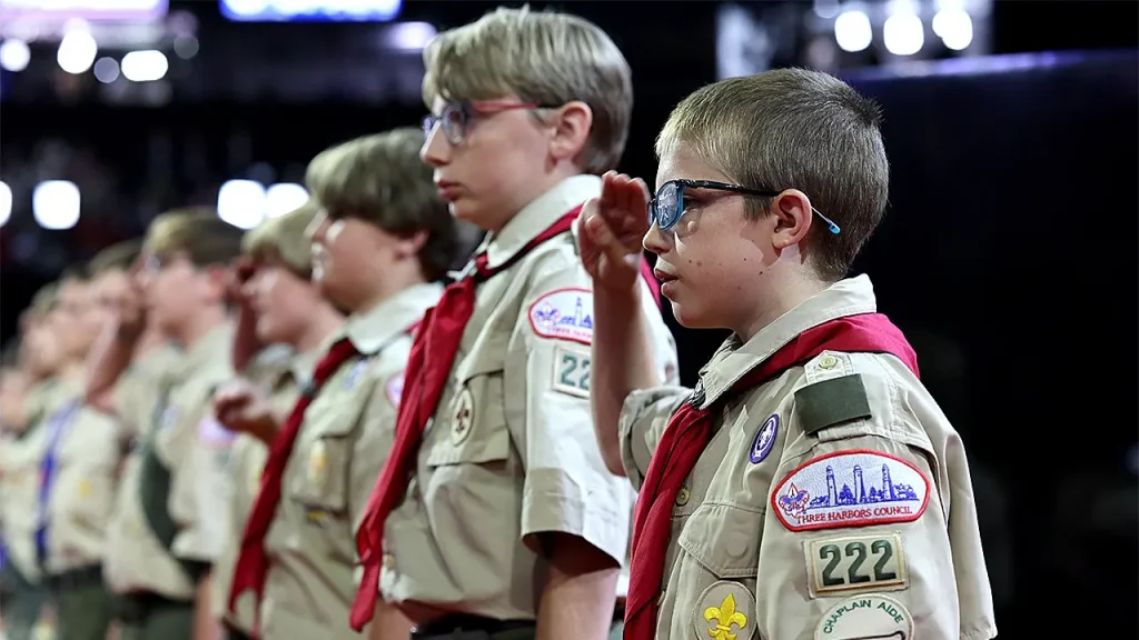 Scouting America aims to move away from 'woke' branding by emphasizing military aspects.