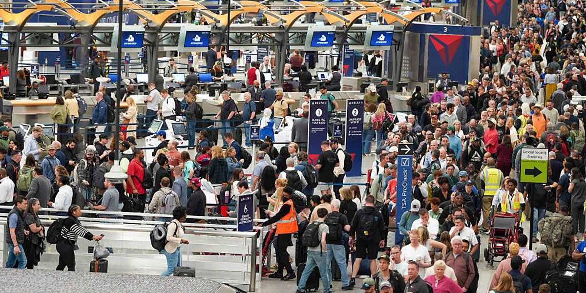 Travelers are waiting in line outside Atlanta airport due to the Democratic shutdown of the DHS.