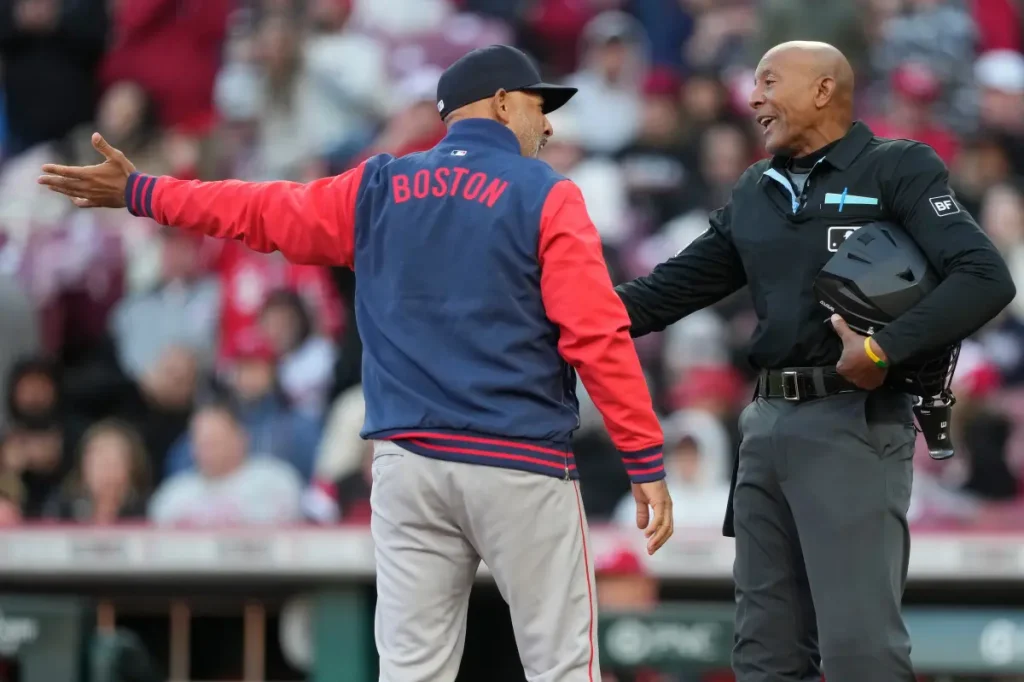 Umpire CB Bucknor has 6 decisions reversed in a single game in an awkward moment.