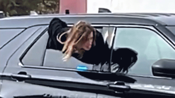 Woman escapes from police car while handcuffed; she was later caught again.