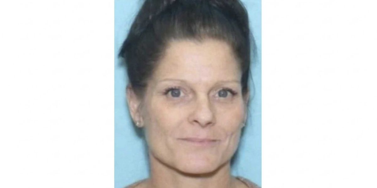 Woman missing for more than a year discovered buried under a garage following a disturbing lead from a friend's tip to the suspect, according to the district attorney.
