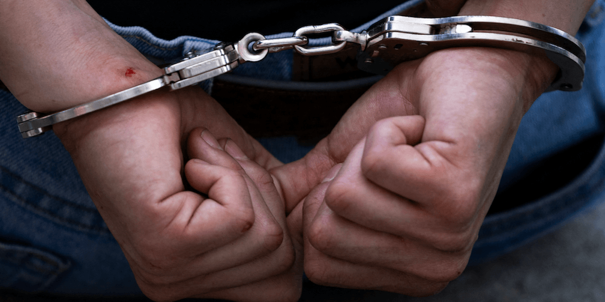 A child allegedly taken into custody for murder following the death of a 12-year-old girl who defended her sister during an apparent bullying situation.