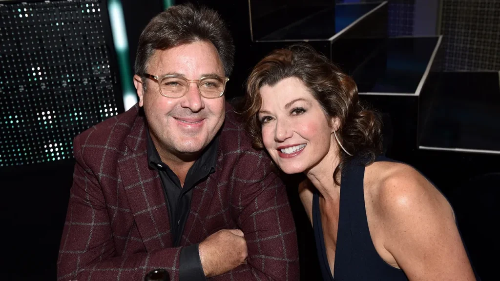 Amy Grant discusses Vince Gill's guidance while recovering from a TBI on her podcast.