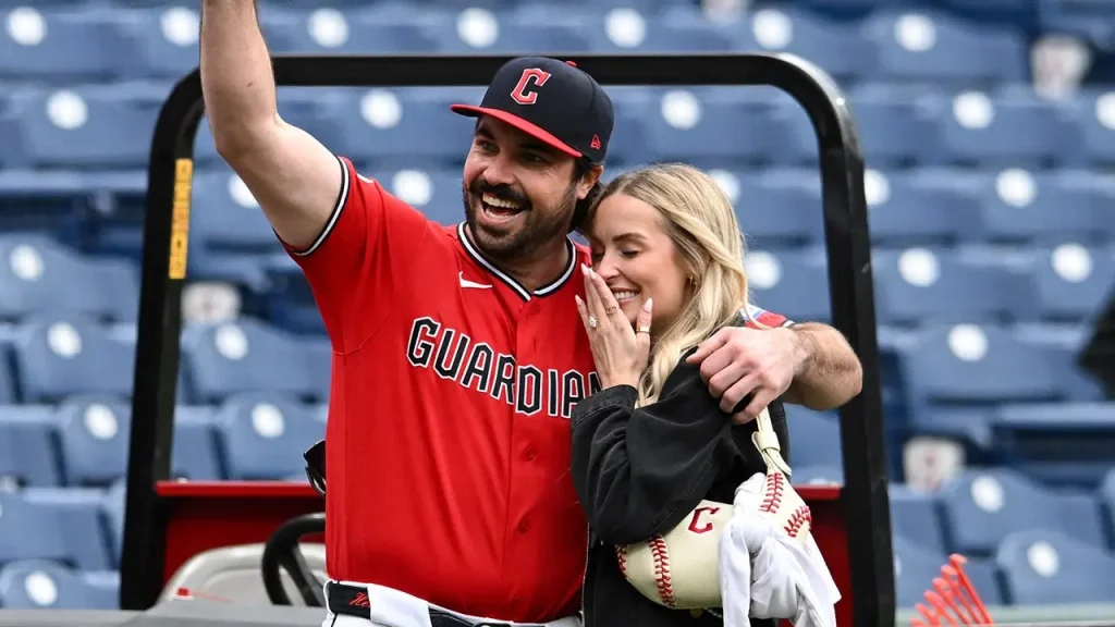 Austin Hedges proposes on the field following the Guardians' victory over the Orioles