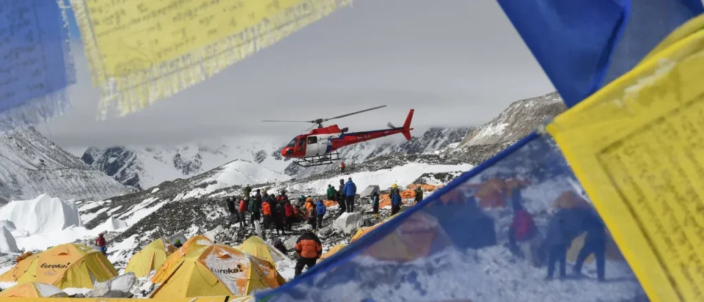 Authorities in Nepal accuse guides of poisoning climbers in a large rescue operation at the world's highest mountains.