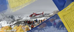 Authorities in Nepal accuse guides of poisoning climbers in a large rescue operation at the world's highest mountains.