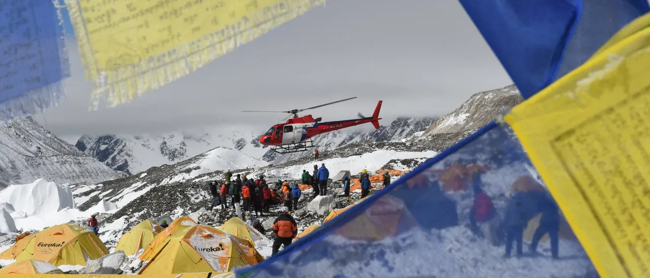 Authorities in Nepal accuse guides of poisoning climbers in a large rescue operation at the world's highest mountains.