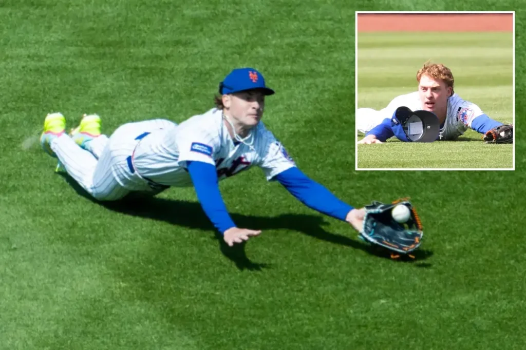 Carson Benge makes a diving catch to support the Mets despite ongoing batting struggles.