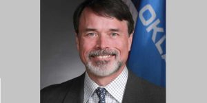 Democrat ends re-election campaign after incident with fake kissing photo, yet other Democrats still seek additional support.