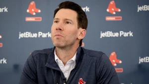 Did the Boston Red Sox GM change most of their coaching team due to a single player?