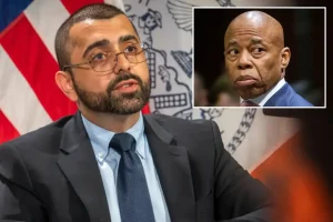 Dismissed Adams employee returns to City Hall while suing the city.