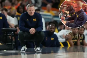 Dusty May was watching UConn-Illinois from the sidelines prior to Michigan's Final Four match.