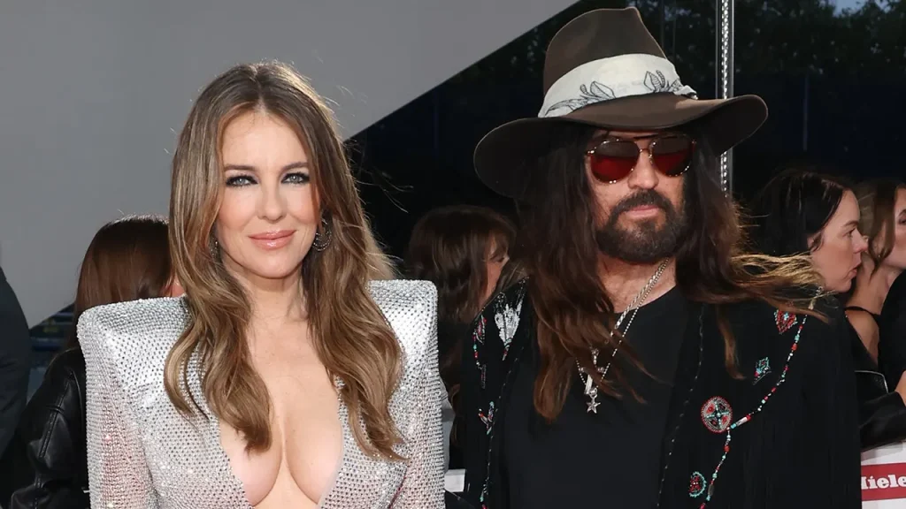 Elizabeth Hurley and Billy Ray Cyrus attend the Olivier Awards red carpet event