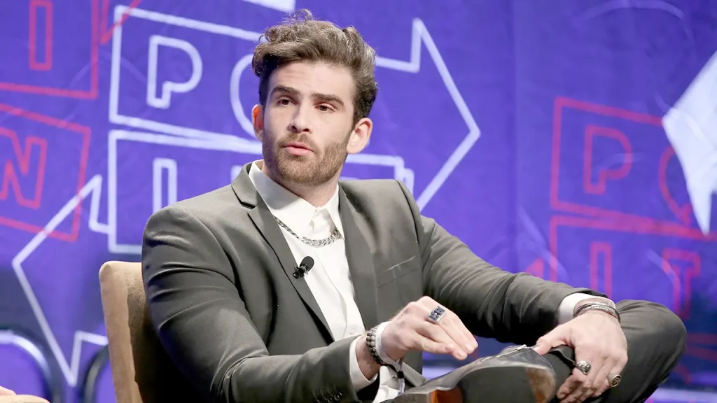 Hasan Piker expresses support for taking from large companies on a podcast.