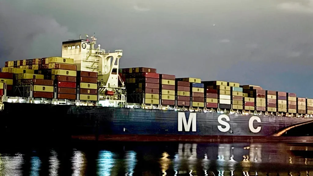 Iran shifts captured container ships in the Strait of Hormuz towards port, sources indicate.