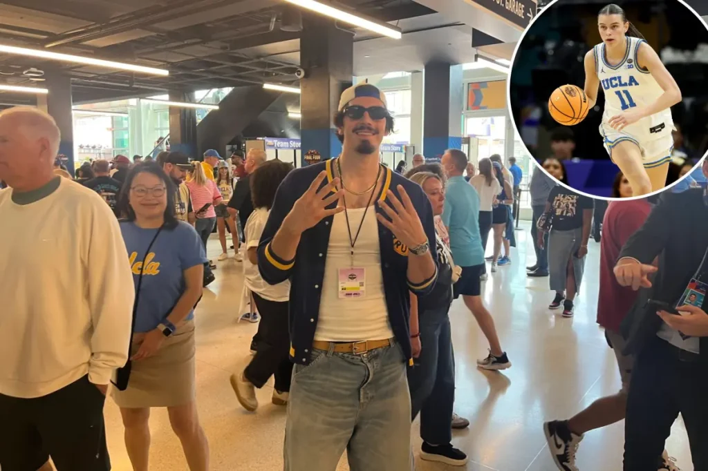 Jaime Jaquez watches UCLA play South Carolina in the national championship.