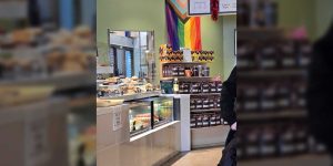 LGBTQ+ group reacts strongly after coffee shop chooses to focus on serving coffee instead of promoting with flags.