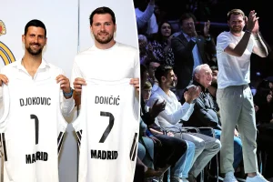 Luka Doncic and Novak Djokovic seen at a Real Madrid basketball game before the Lakers playoff series