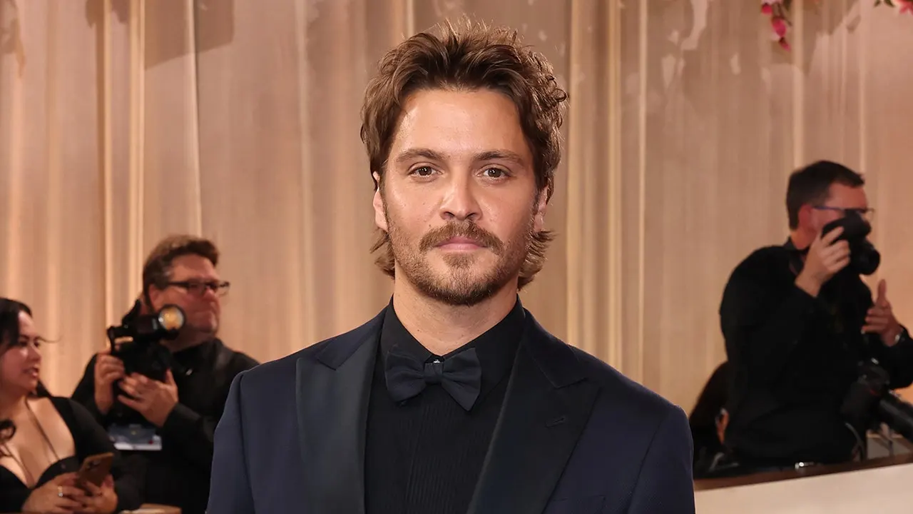 Luke Grimes from 'Yellowstone' discusses hiding outlaw country music from his pastor father.