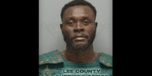 Man charged with killing a woman by striking her head with a hammer in brutal incident outside a convenience store.