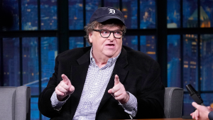 Michael Moore alleges that Trump threatened a holocaust for Iran and states that Democrats are involved.
