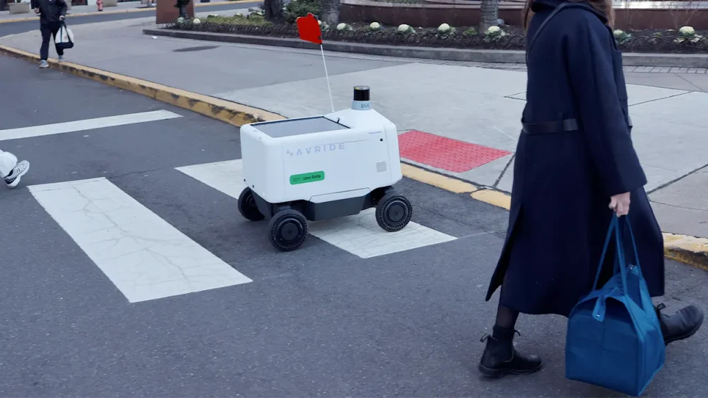 Philadelphians kick and sit on Uber Eats delivery robots
