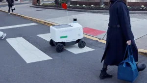 Philadelphians kick and sit on Uber Eats delivery robots