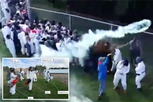 Police use rubber bullets and tear gas to disperse 1,000 animal rights protesters outside a research facility.