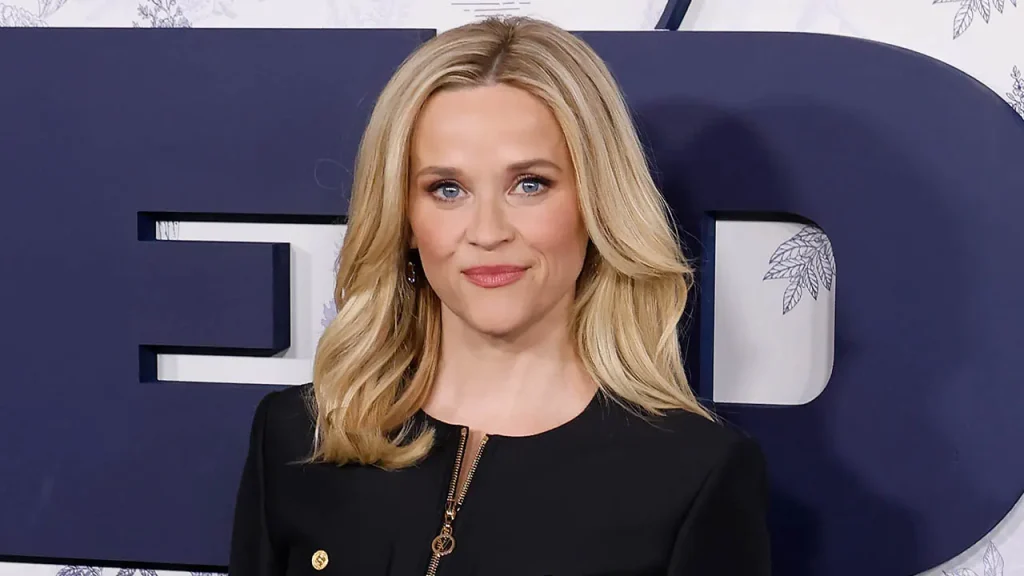 Reese Witherspoon clarifies she isn't being paid to endorse AI and stands by her post.